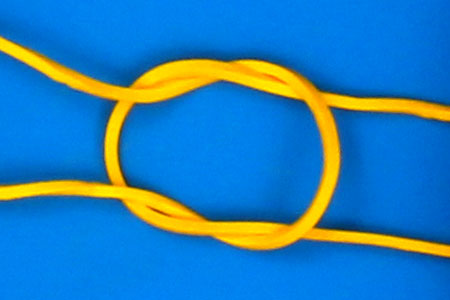 Two rubber bands connected with a square knot