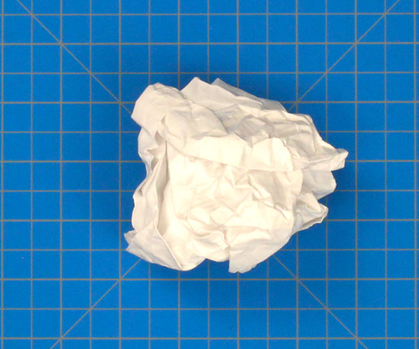 Paper Airplane Crumpled Into A Ball