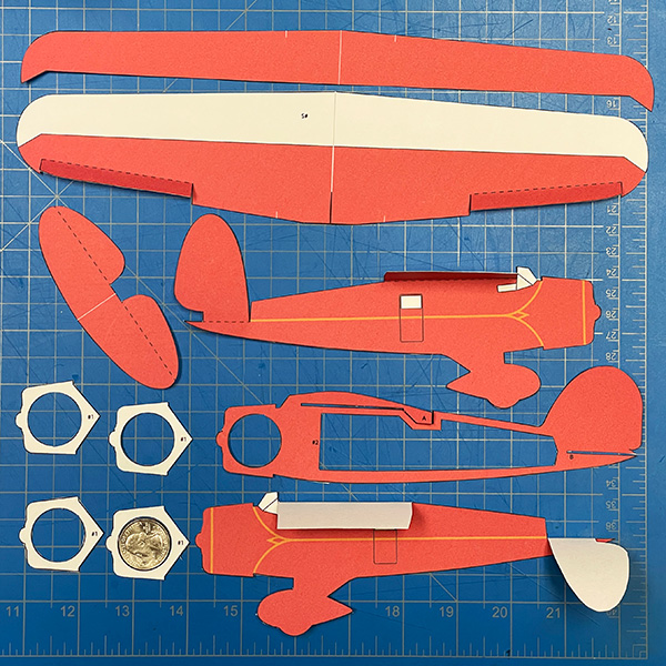 Paper airplane pieces ready to assemble