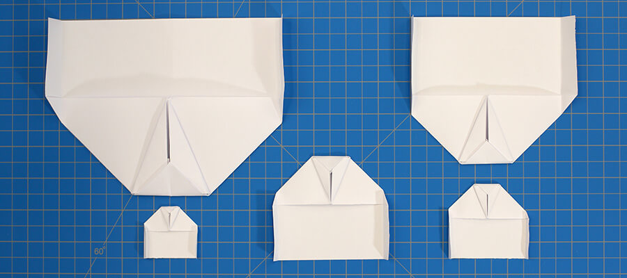 Paper airplane gliders of different sizes