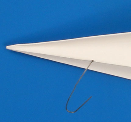 Paperclip attached to paper airplane. Step 1