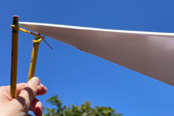 Finger and rubber band paper airplane launcher