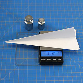 Weighing a paper airplane